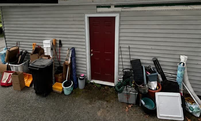 Before a recent RZ junk removal job, with items awaiting removal